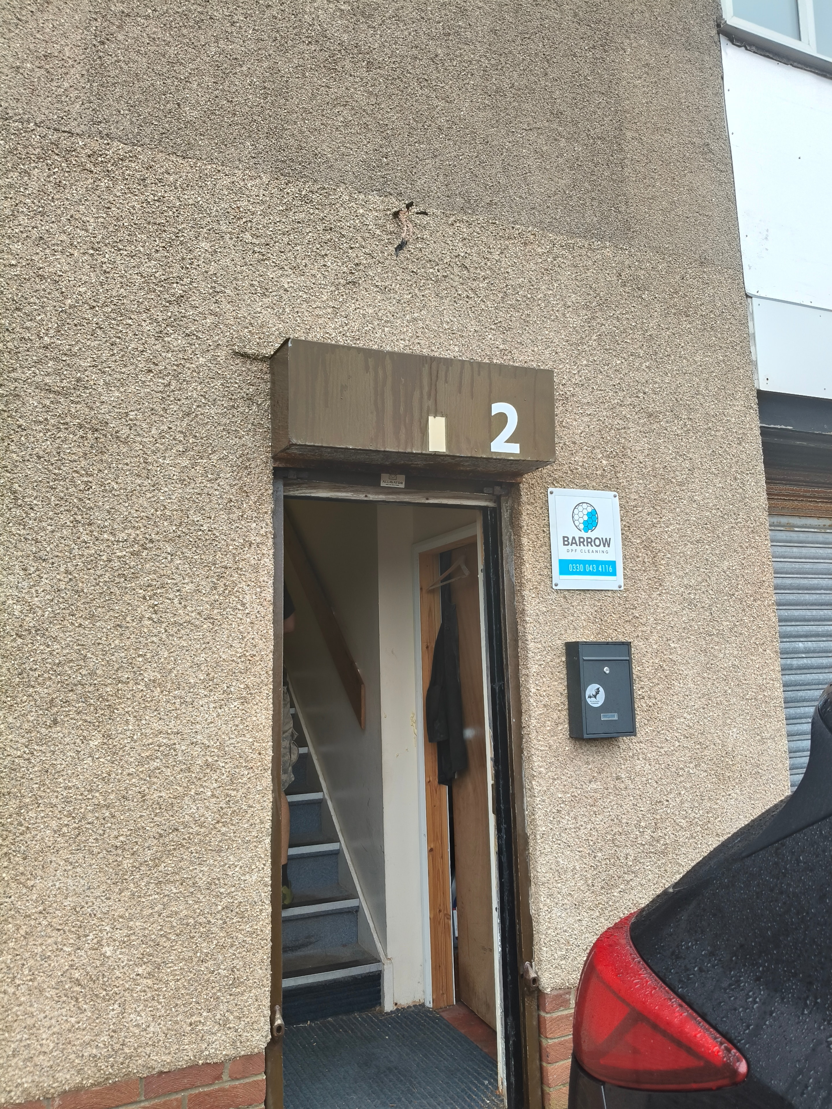Unit 2 Shore Street entrance with Barrow DPF Cleaning sign